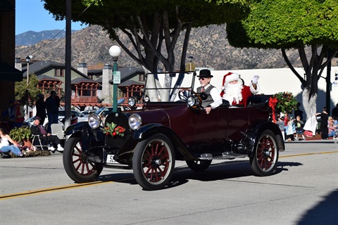 Santa Claus in a vintage car during the Glendora Christmas Parde