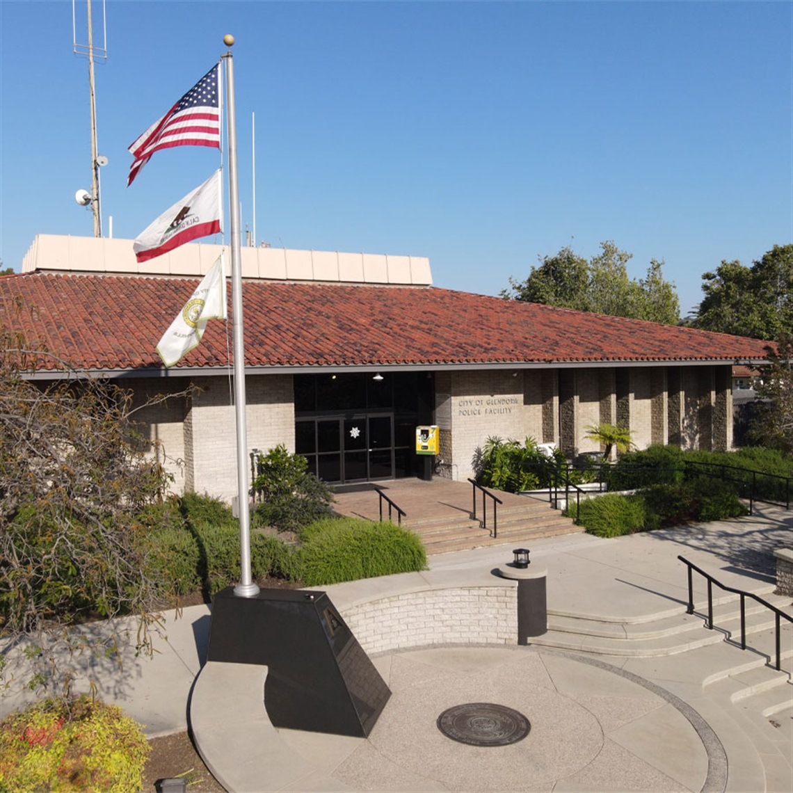 Aerial photo of the Glendora Police Station with Pompei Memorial and flag pole